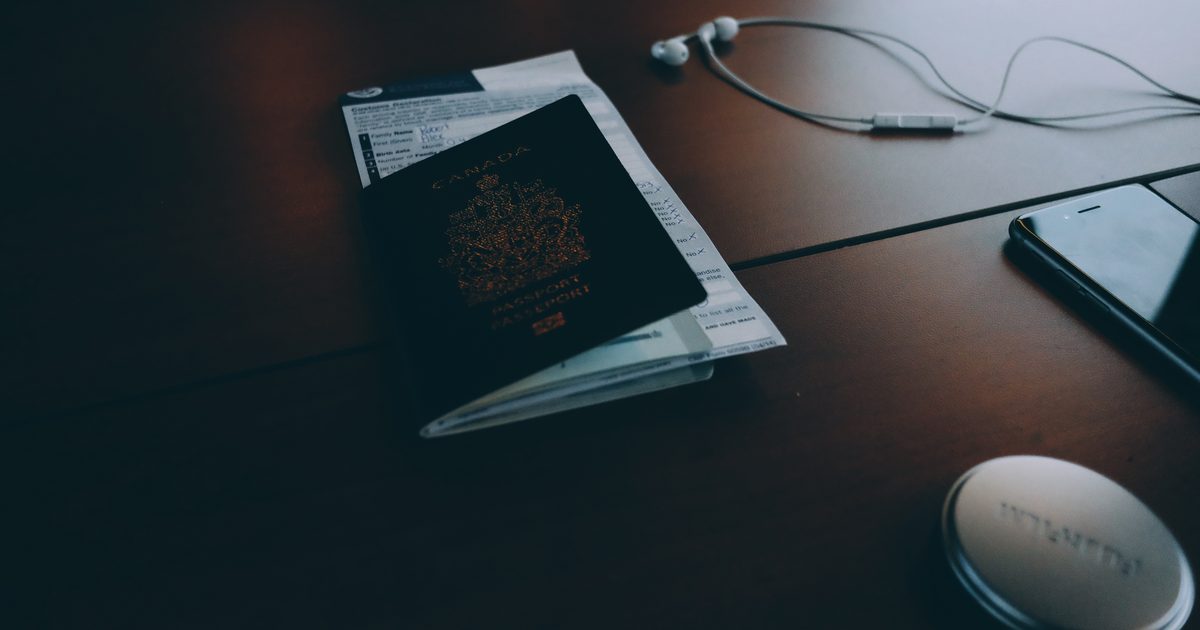 Passport and travel documents on a desk prepared for an Australian visa application